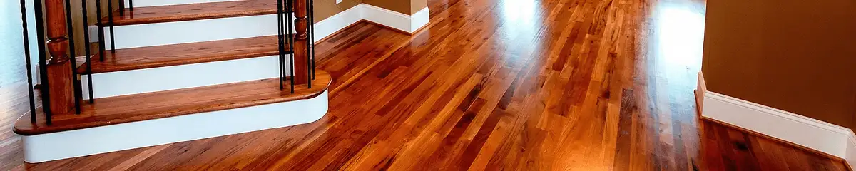 Base floor of a staircase with professionally restored wood flooring in New Haven CT