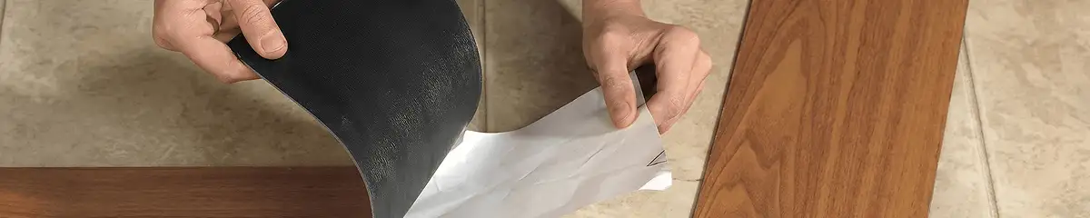 A professional installing vinyl flooring in New Haven, CT