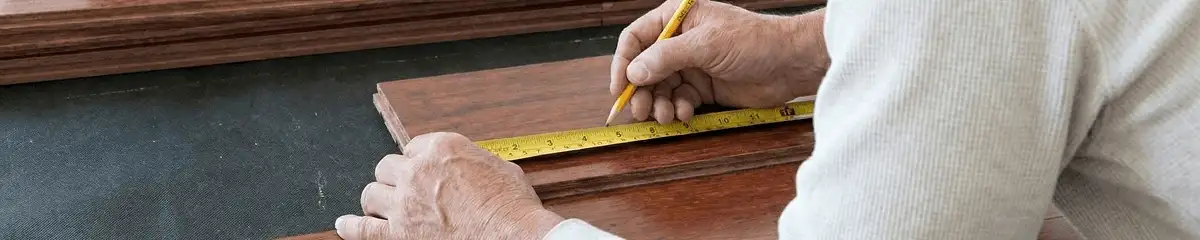A professional installing wood flooring in New Haven, CT